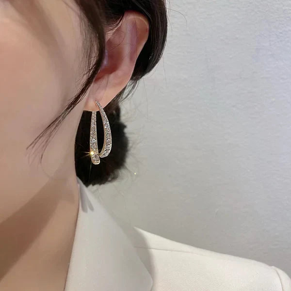 | Cross-shaped curved earrings
